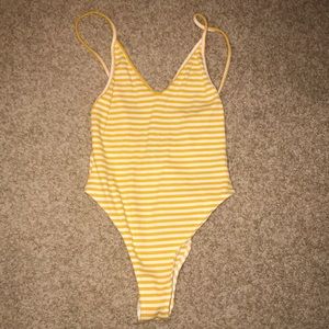 White and yellow striped body suit